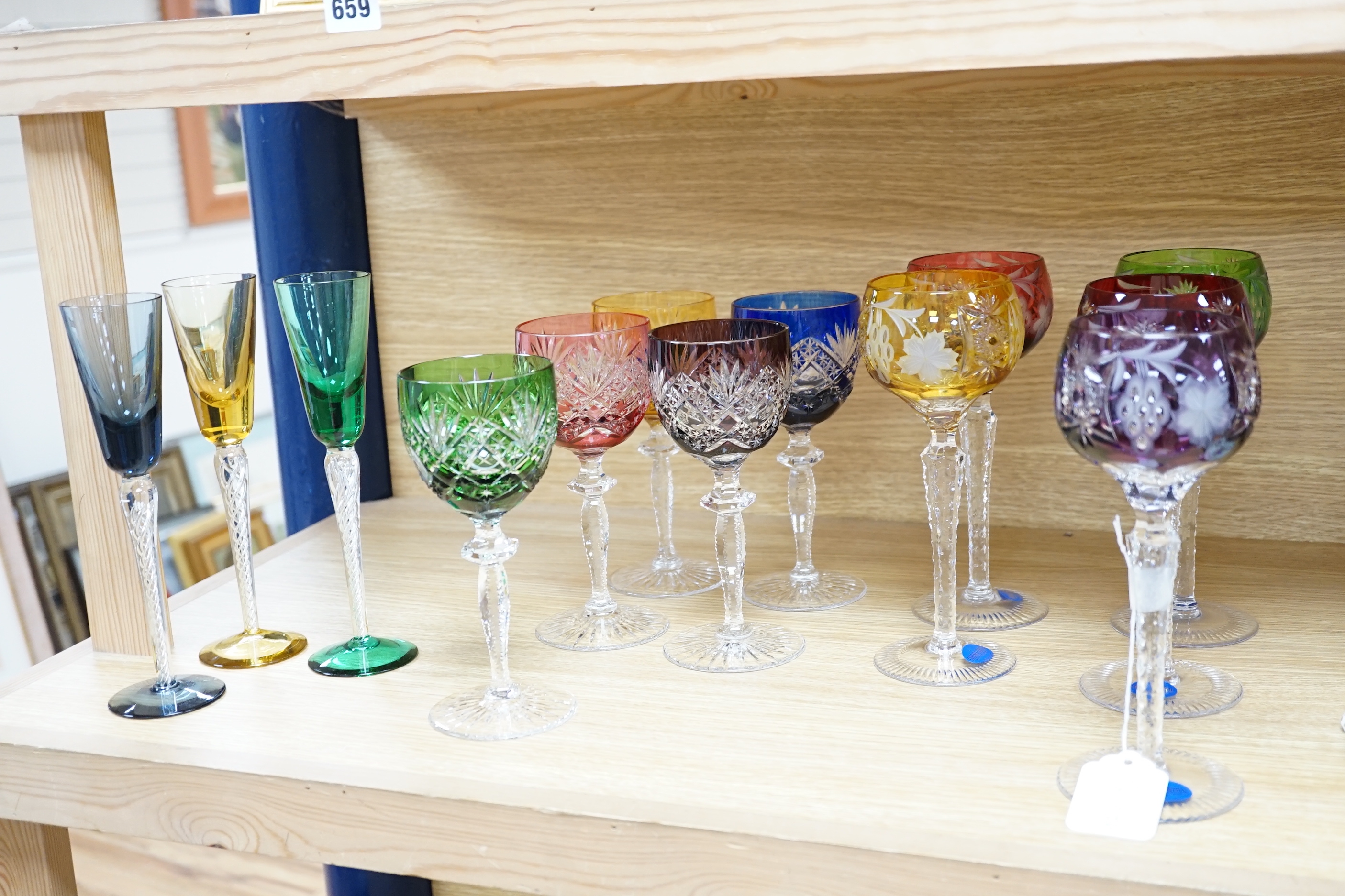 Two sets of six Harlequin colour flashed hock glasses and a set of four air twist glasses